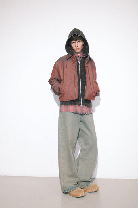 A model wearing the Our Legacy FW25 shearling Blizzard Jacket and Third Cut denim.