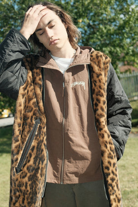 Person wearing a Stüssy Nylon Beach Shell Coffee