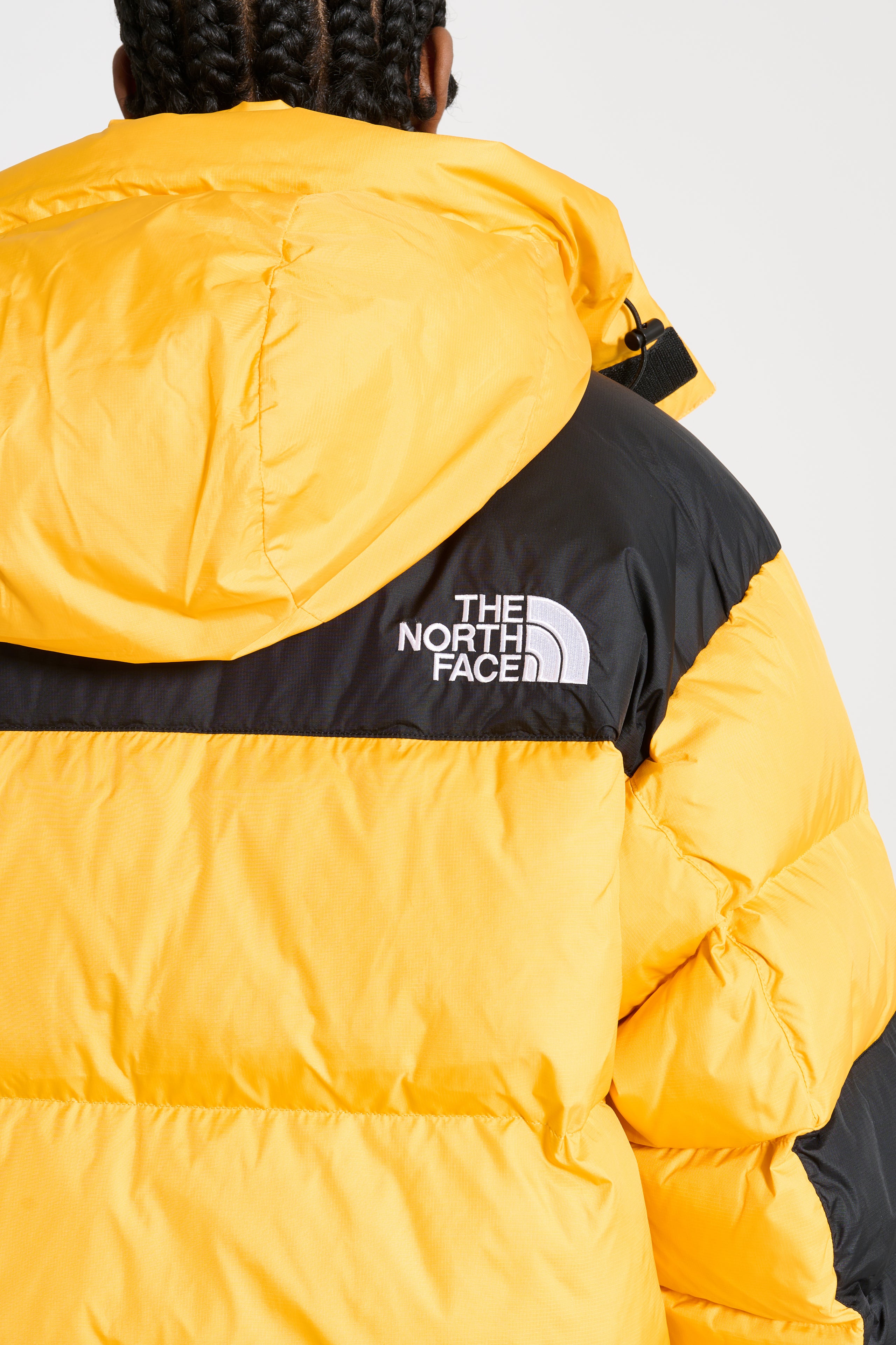 The North Face Himalayan Baltoro Jacket Summit Gold / TNF Black