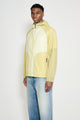 The North Face U NSE Wind Jacket Lemon Mist / Pear